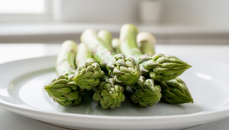 Macro close-up of fresh asparagus spears with visible texture on a cutting board